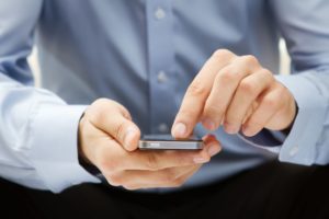 11326201 - close up of a man using smartphone